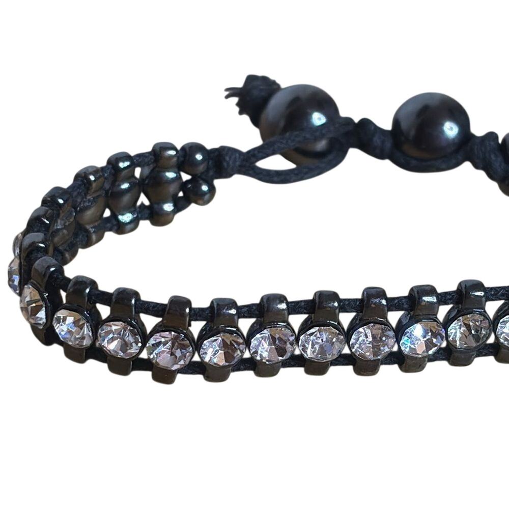 Black corded bracelet with white silver tone rhinestones with beaded closure